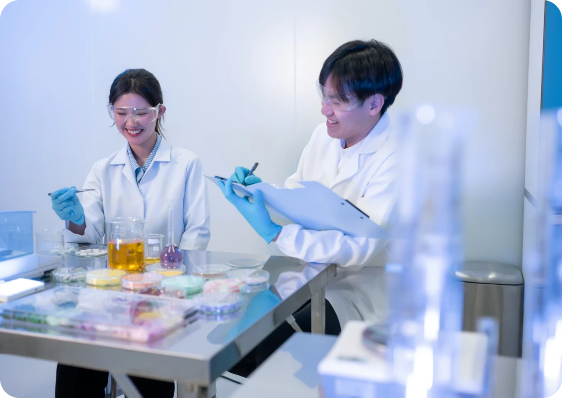 Researchers working with lab equipment