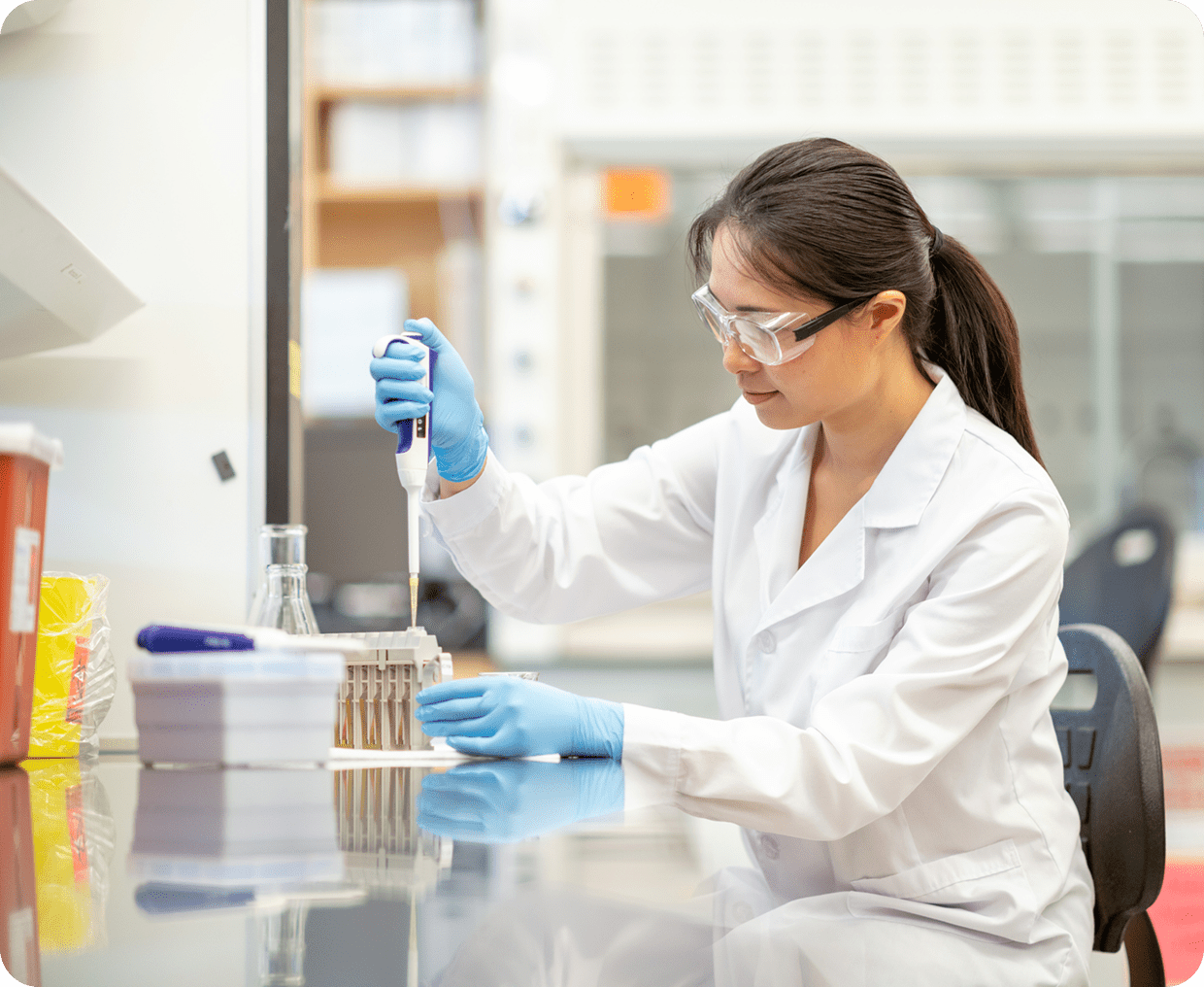 Woman conducting experiment in laboratory
