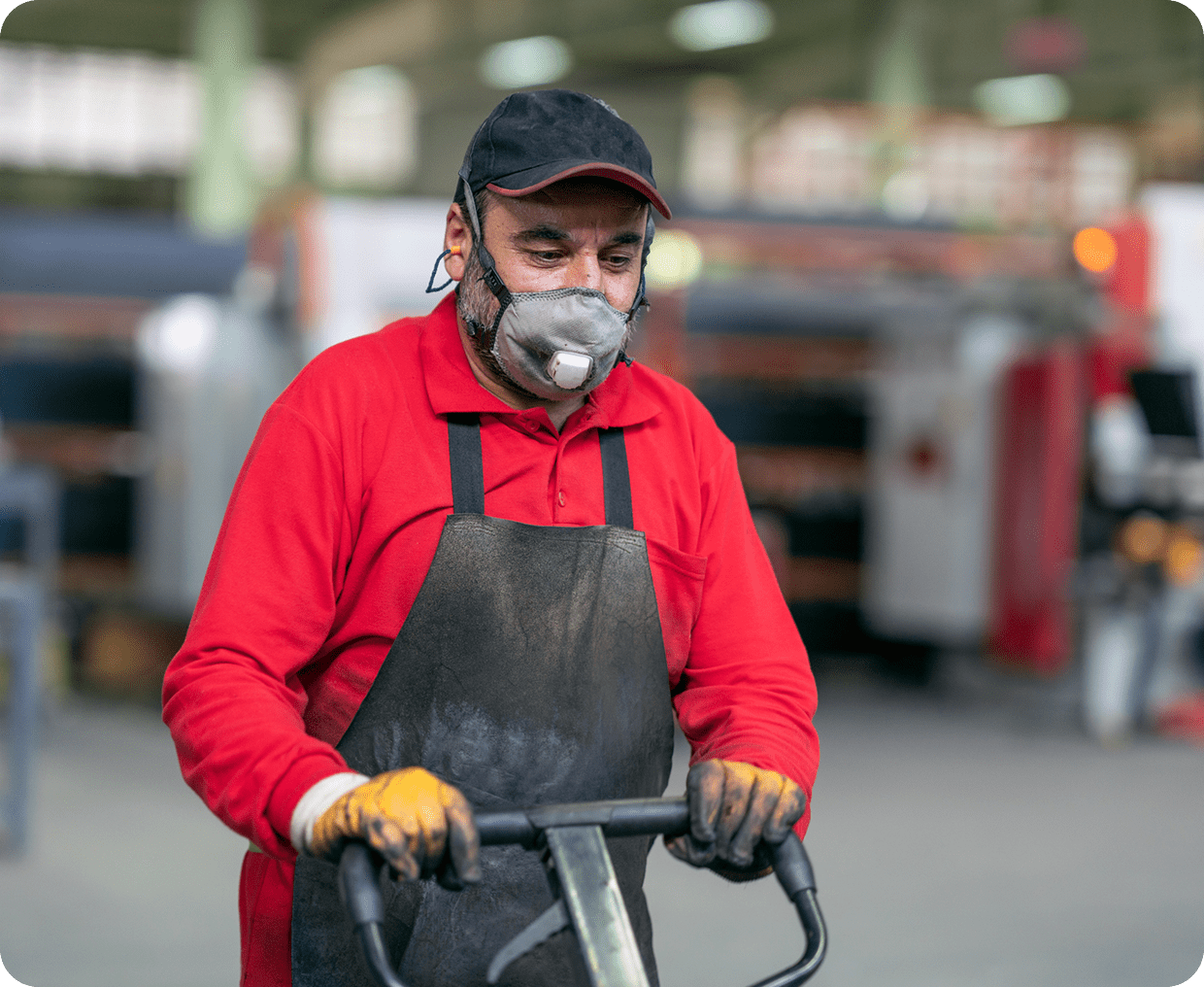 Man operating machinery in industrial setting