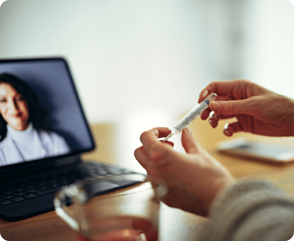 Telehealth session with doctor on laptop screen